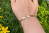 Channel: Gold Anticlastic Bracelet Narrow